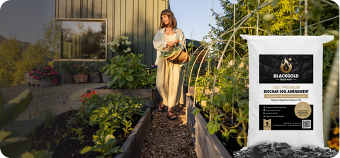 Woman standing in a garden with a Black Gold Biochar product in the foreground